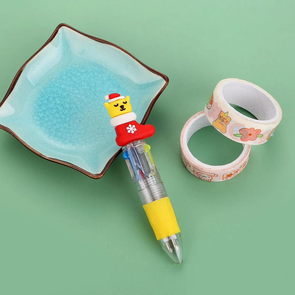 11 cm plastic four-colour Christmas ballpoint pen with press-action top and festive designs.