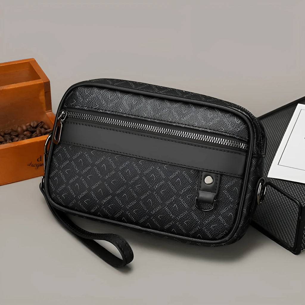 Men's black casual shoulder messenger bag with geometric pattern and handheld strap.