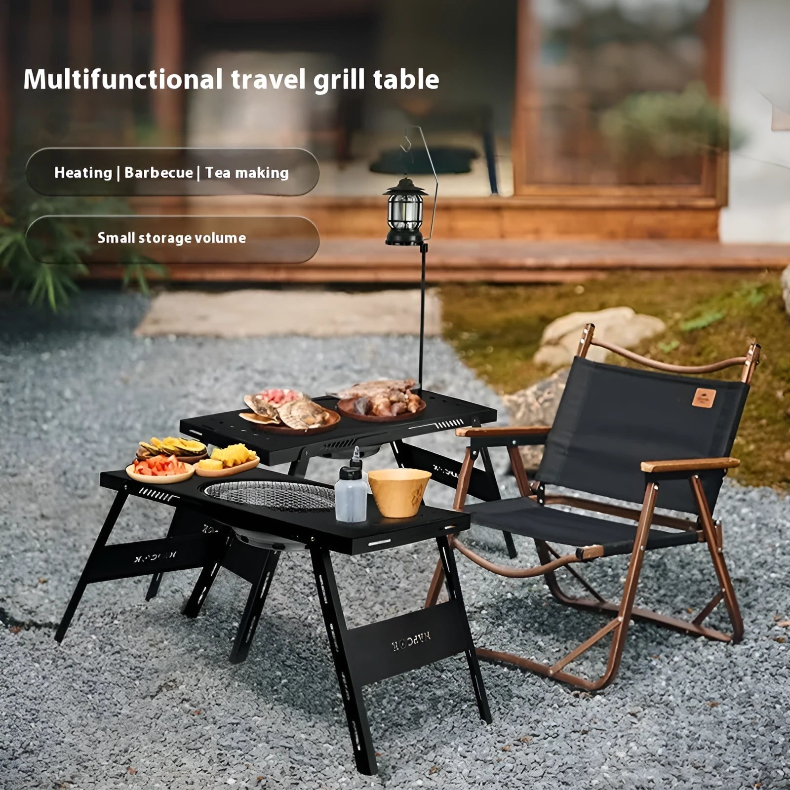 Black folding steel camping table with an integrated barbecue grill set up outdoors.