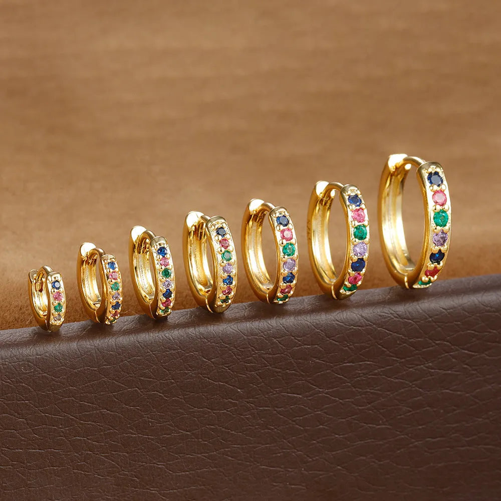 Circle zircon perforated stud earrings in gold, rose gold, silver colours with geometric design