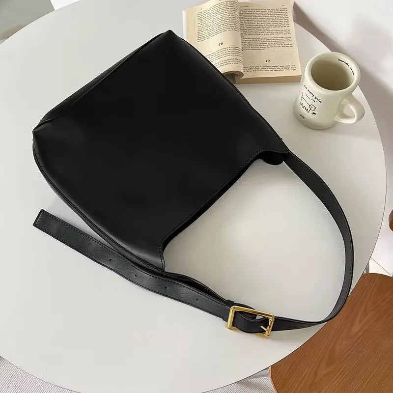 Two soft PU women's shoulder bags with swing threads decoration, shown in black and brown colour options.