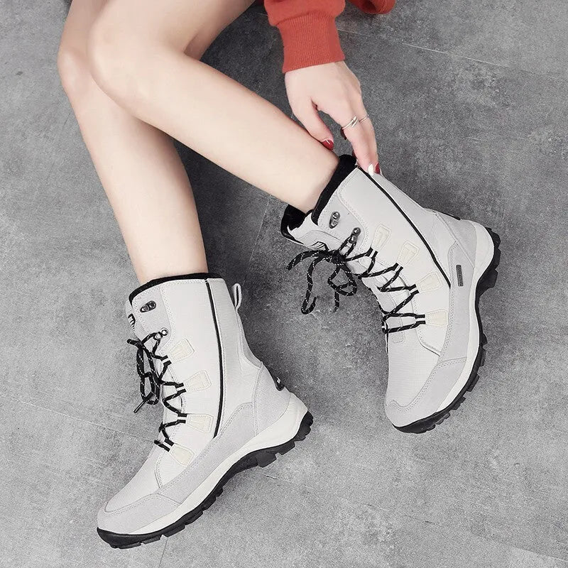 Women's mid-calf thermal snow boots in black with genuine leather upper and rubber sole for winter outdoor use