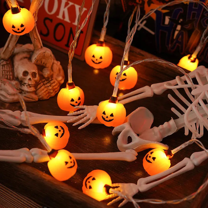 Halloween LED string lights with pumpkin, ghost and bat shaped covers, battery operated, PVC shell, warm white.