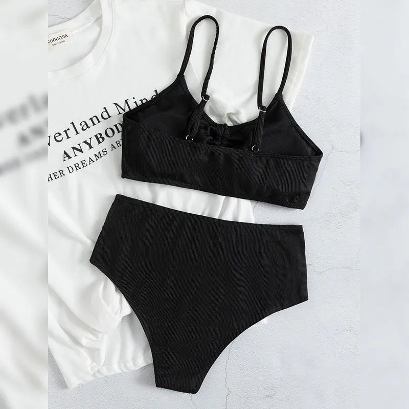 Black women's high waist bikini swimsuit with sling split design showing front view