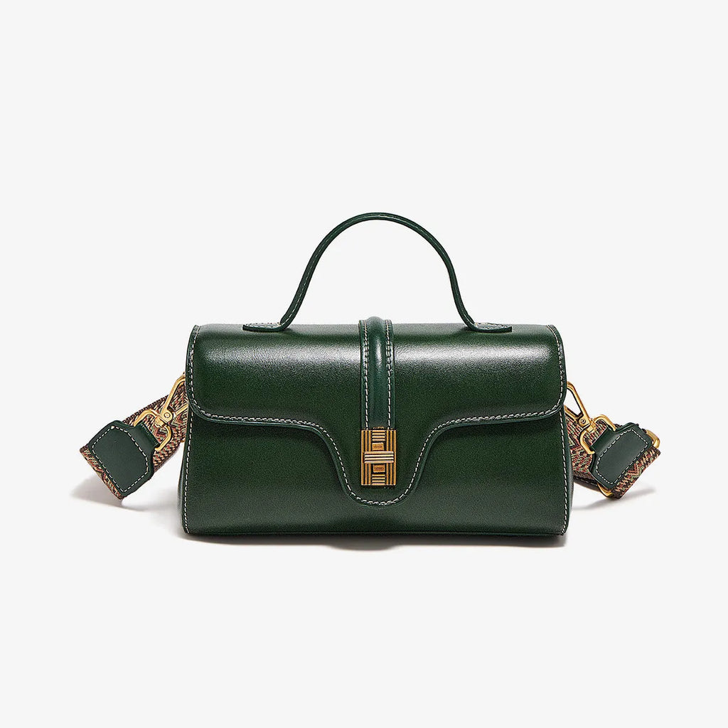Brown Cambridge-style leather messenger bag with a front lock, shown open to reveal internal zipper pockets.
