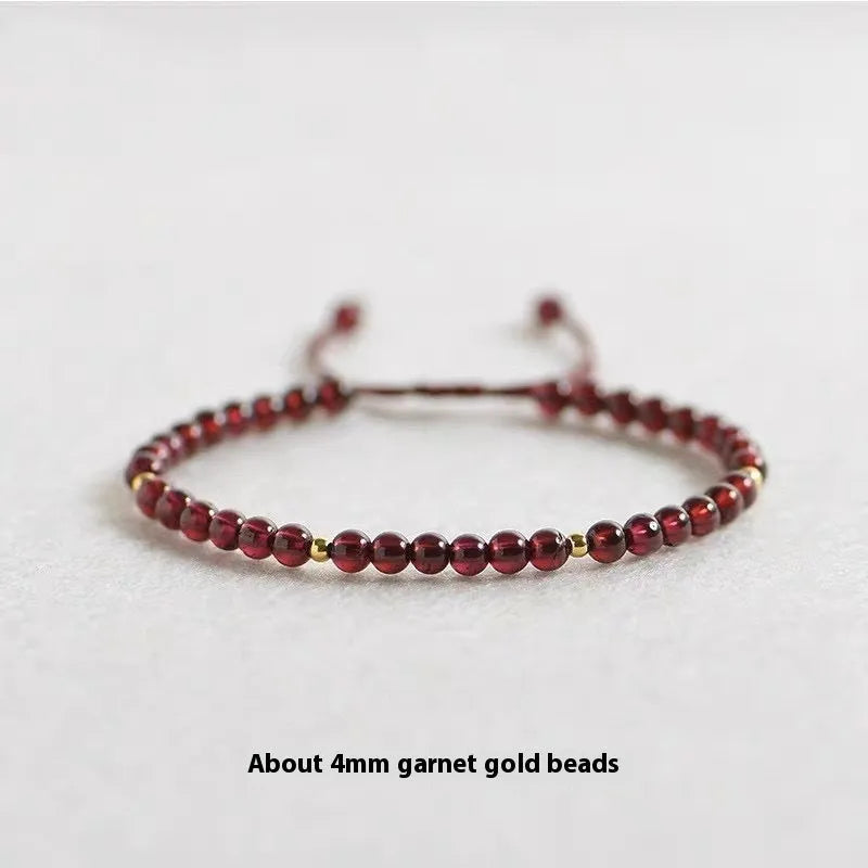 Hand-woven garnet red rope bracelet with flexible wire construction and national tide design elements