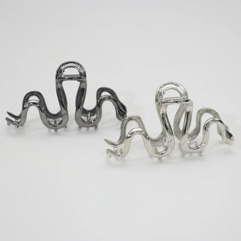 Slytherin serpentine metal hair barrette in silver or gun black, 10.5 cm long.