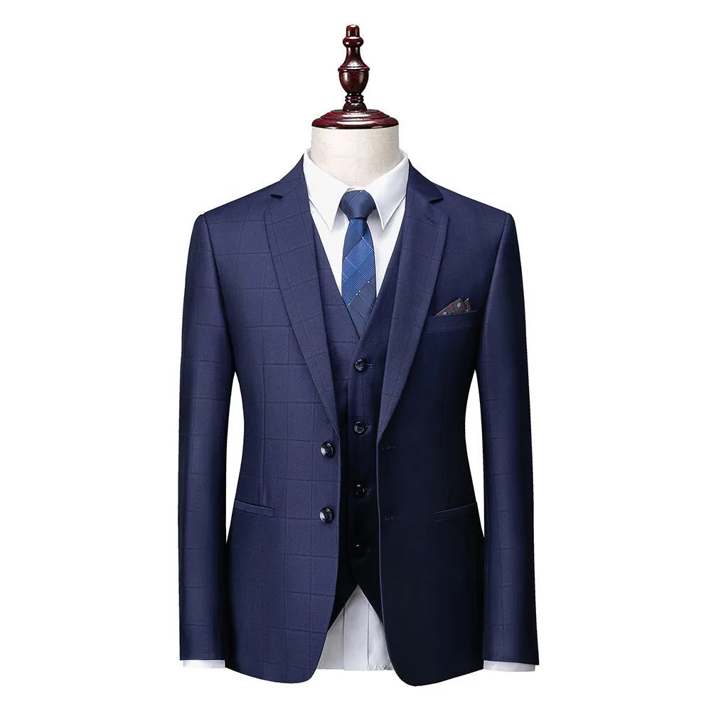 Men's navy blue three-piece slim fit suit with jacket, vest, and trousers on hanger