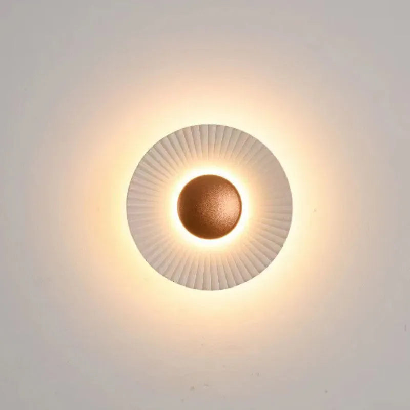 Round wall lamp with aluminium shade and LED light source for bedroom lighting