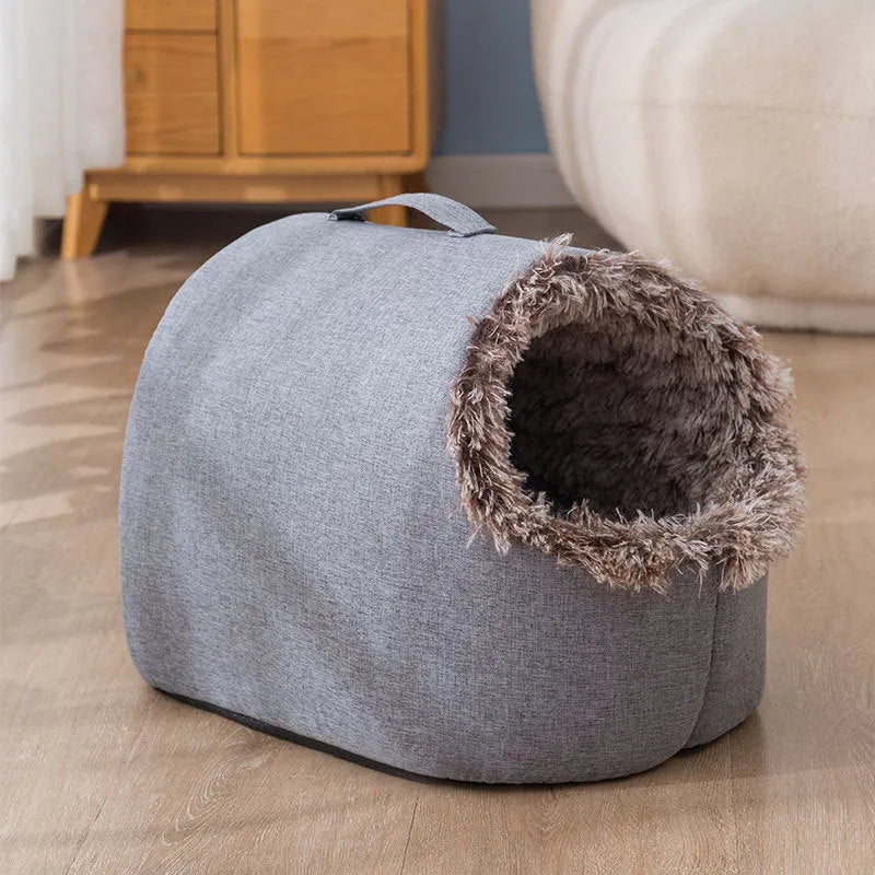 Grey fleece-lined closed cat nest sleeping bag showing enclosed design and soft cloth exterior