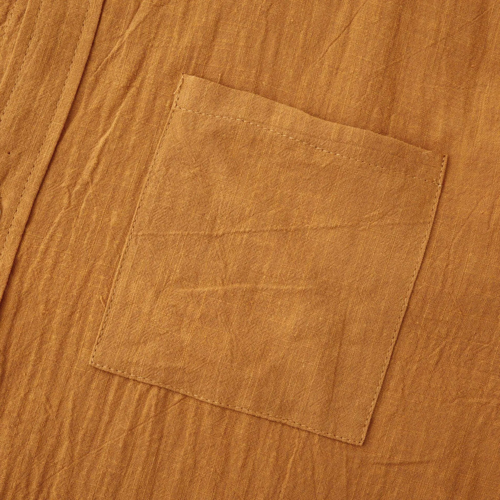 Men's slim fit brown long sleeve shirt and casual pants on a hanger