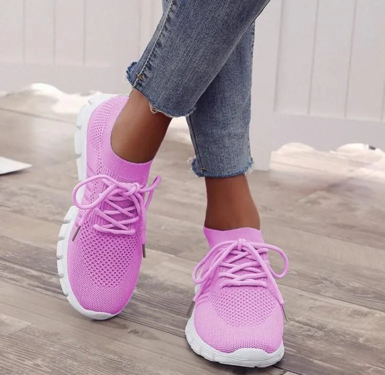 Women's breathable platform sneakers in multiple colours on a white background, showing lace-up front and flat rubber sole.