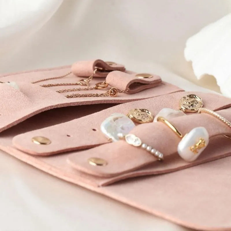 Square brown leather jewellery storage bag measuring 12x12cm for earrings and watches.