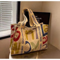 Canvas women's tote bag with printed design showing 45cm width and shoulder strap