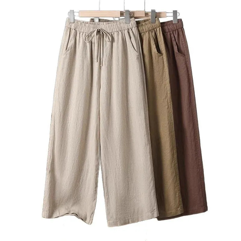 Women's straight-leg casual trousers with elastic waistband and lace-up detail in apricot colour