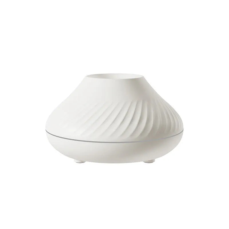 Beige USB aromatherapy diffuser with flame effect lighting on wooden table