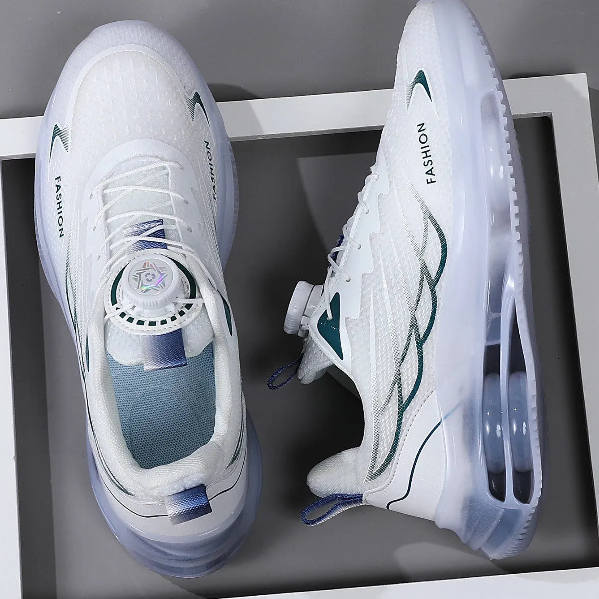 White low-top mesh trainers with rotating button lace-up and rubber soles for sports and casual use