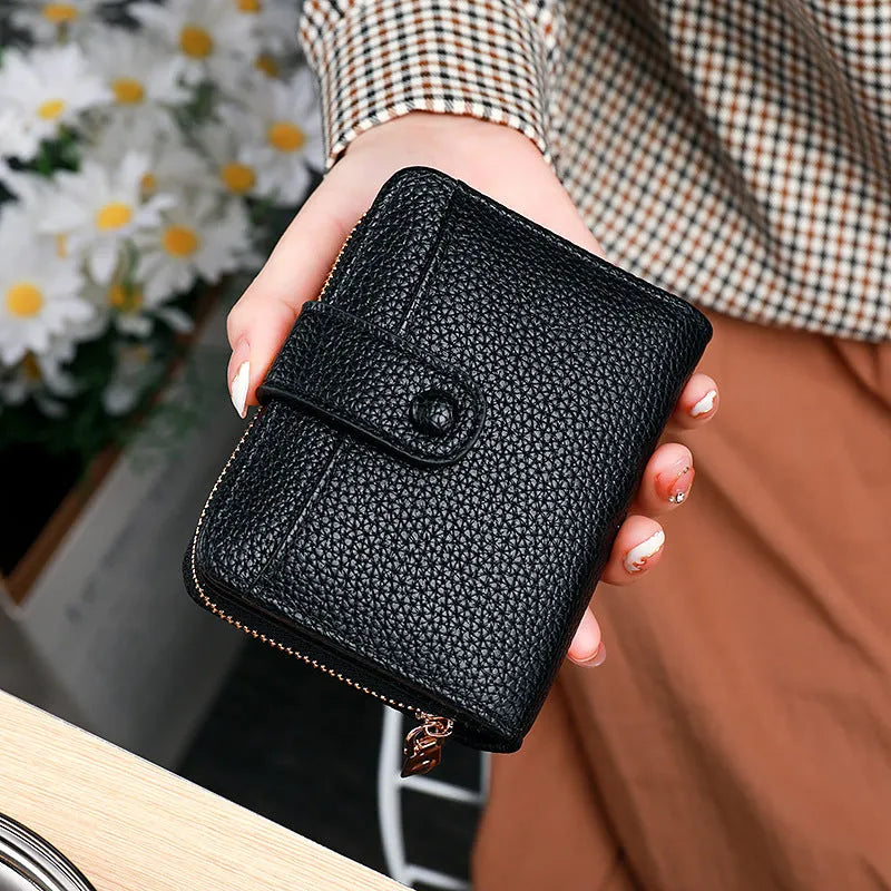 Women's lychee pattern organ short wallet in beige with sewing thread accents and antibacterial lining