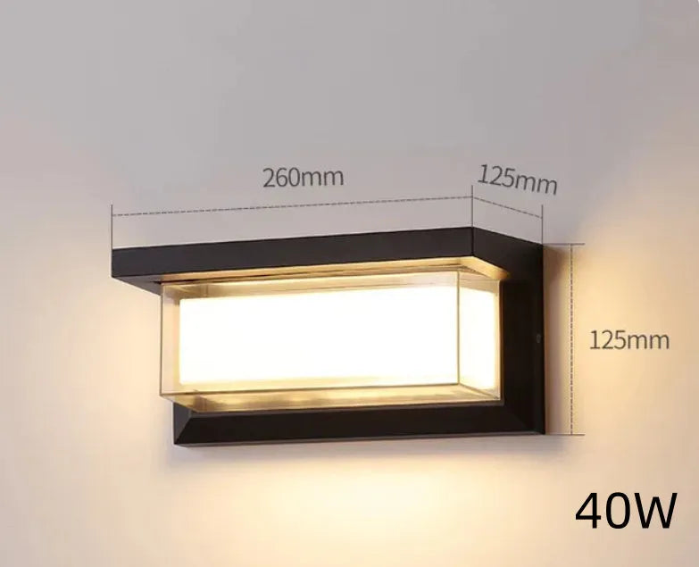 IP65 waterproof outdoor wall lamp with acrylic shade and aluminium body, shown in a garden setting.