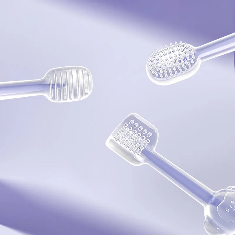 Purple soft silicone toothbrush for cleaning cat and dog teeth on a white background.