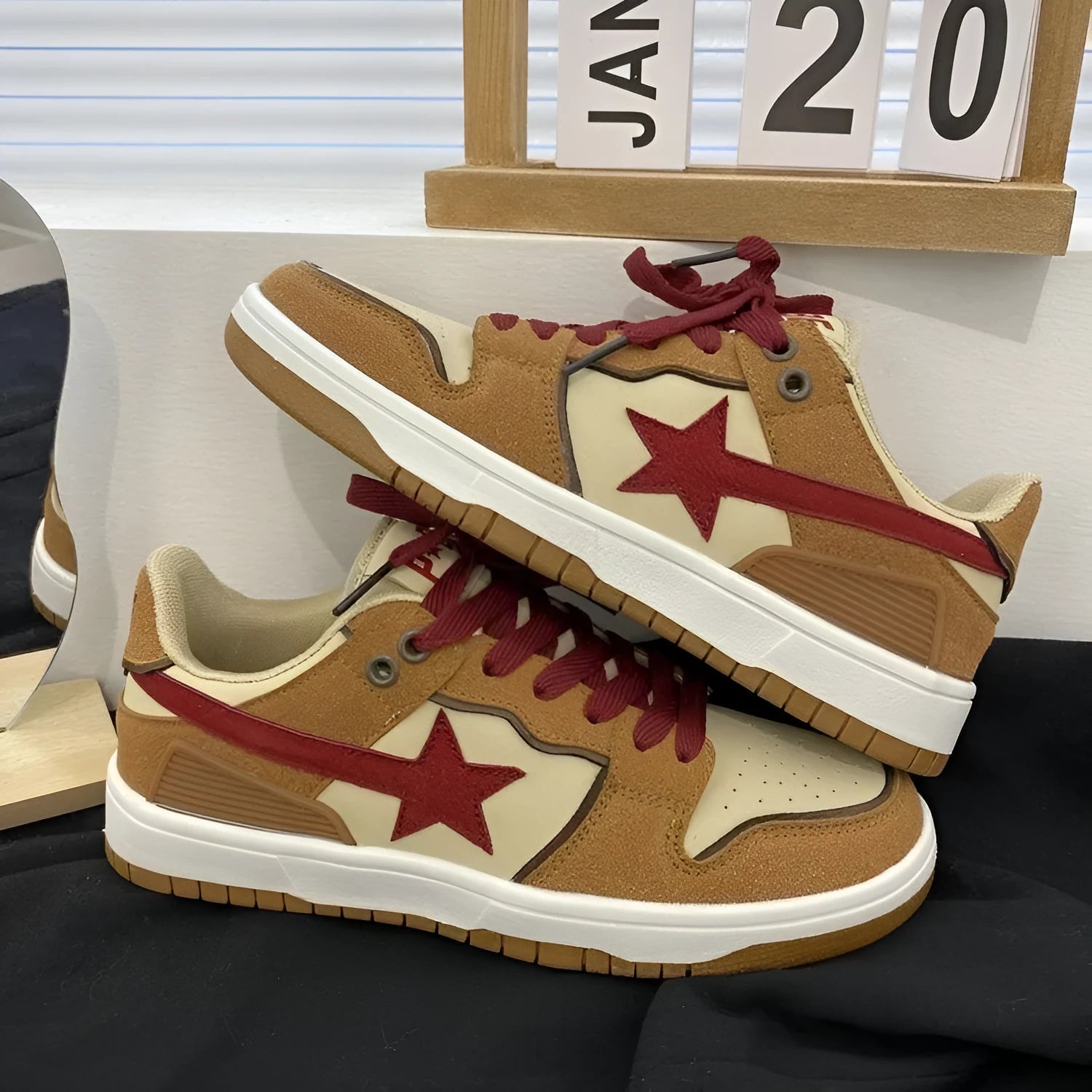 Brown low-top women's platform sneakers with sequin details and lace-up front.
