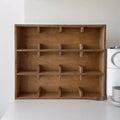 Solid birch wood cup storage rack with multiple grid compartments in meridian colour finish