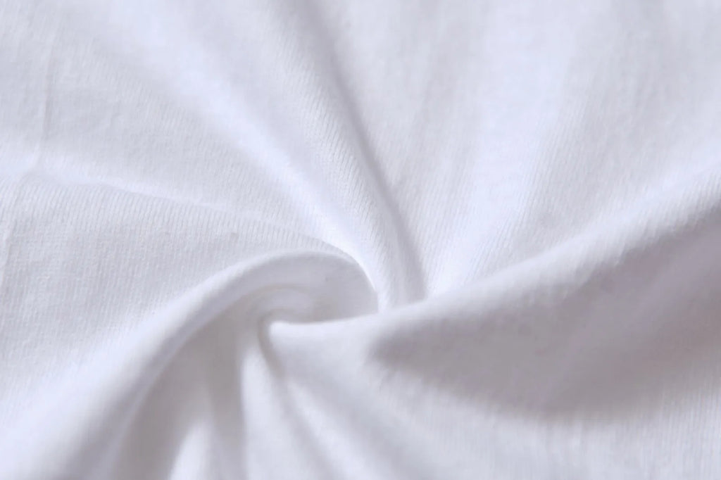 White cotton t-shirt overalls with round neck and short sleeves in patterned design