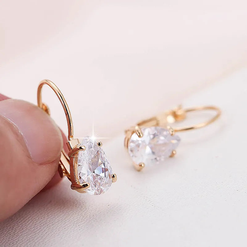 Drop-shaped copper earrings with platinum inlaid gem, gold or platinum plating, approximately 2.5 cm long