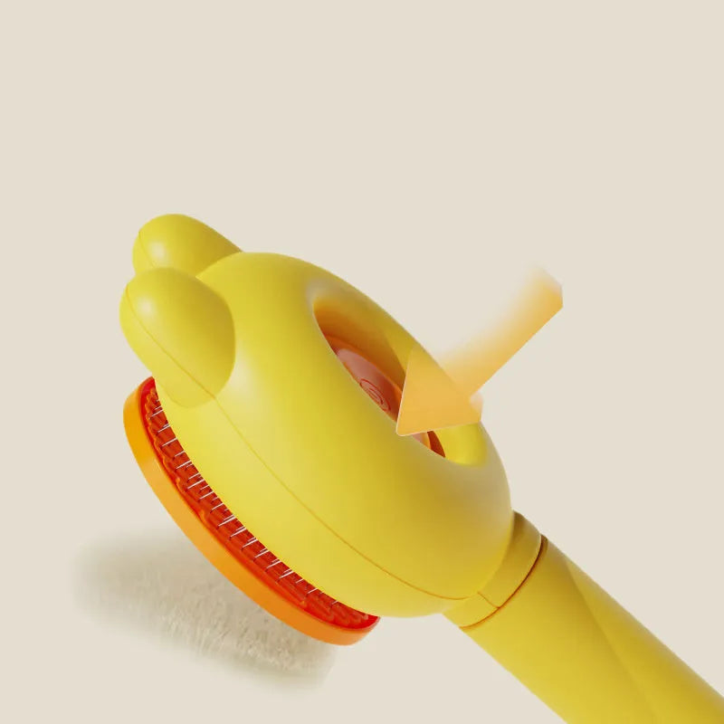 Cat grooming brush with green handle, self-cleaning button, and stainless steel comb for pet hair removal