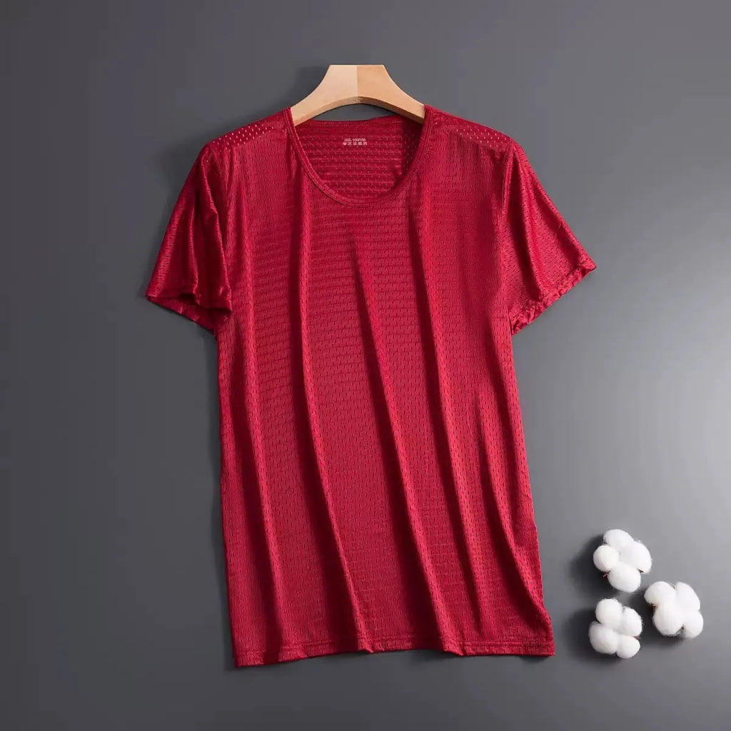 Man wearing a grey ice silk short sleeve t-shirt showing its loose fit and crew neck design for summer.