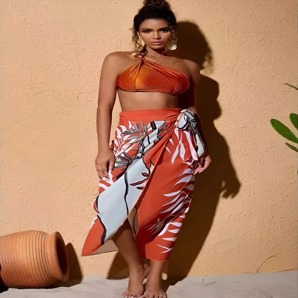 Brown high waisted women's push up bikini swimsuit with chiffon skirt overlay and split design.