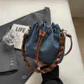 Blue one-shoulder cross body bucket messenger bag with a strap.