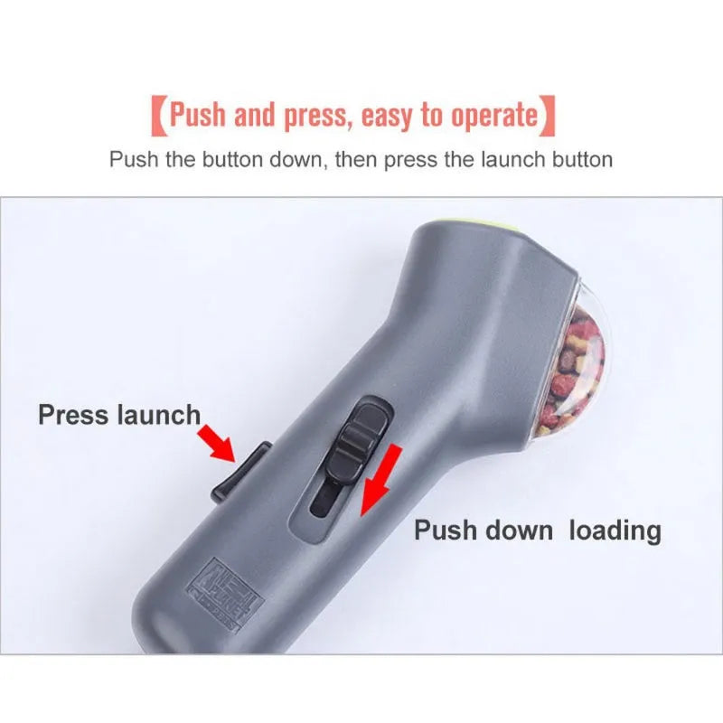 Grey pet snack catapult launcher measuring 18 cm long with spring trigger for 3-metre treat ejection