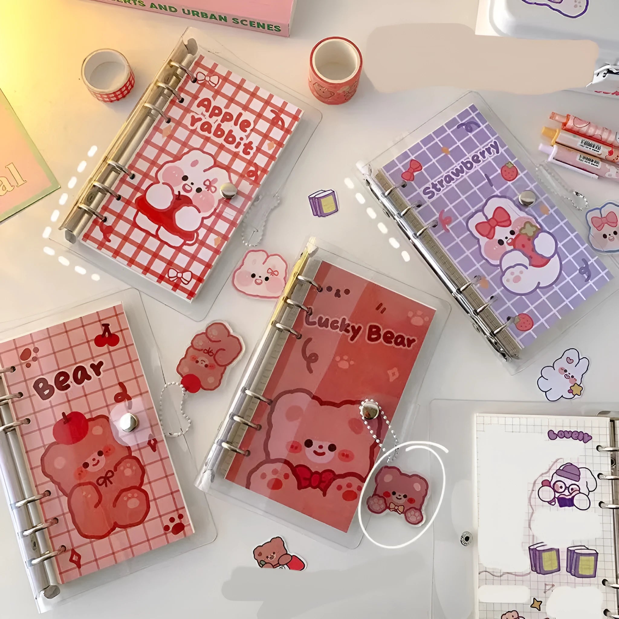 A6 loose-leaf coil notebook with girls heart design, showing 6-hole binding and compact 90x170mm size