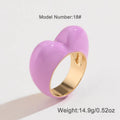 Three-dimensional heart-shaped enamel ring in black, pink, purple, or red colour, made from zinc alloy, sized 17 or 18.