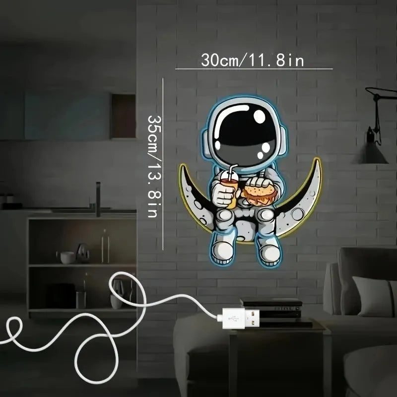 Astronaut-shaped LED neon wall light with moon background, measuring 30 cm by 35 cm.