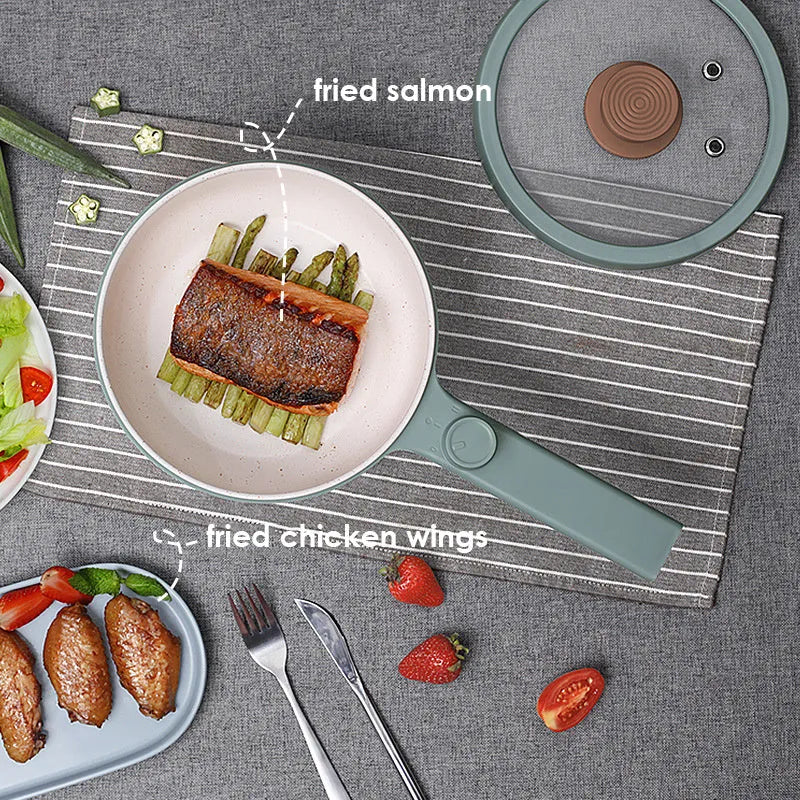 White or green portable electric hot pot cooker with multi-function controls on a countertop.