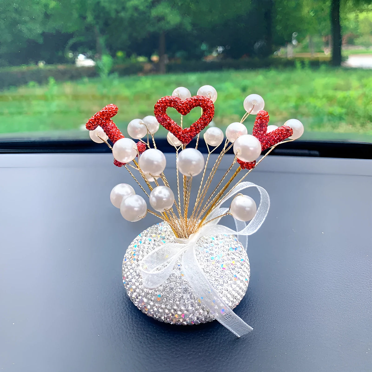 Clay star-shaped car centre console ornament with diamond and pearl decoration in various colour themes.