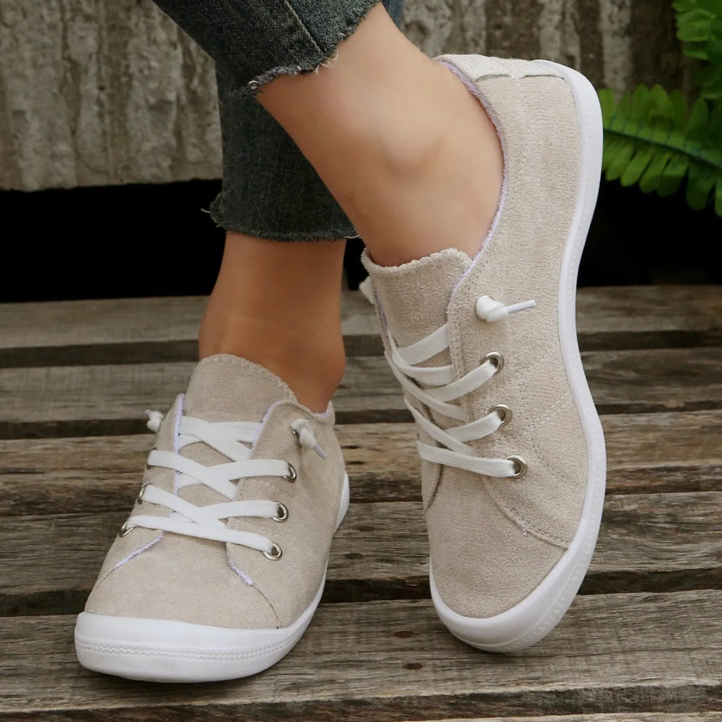 Women's creamy-white casual sneakers with fabric upper and rubber sole, low-top design for versatile wear