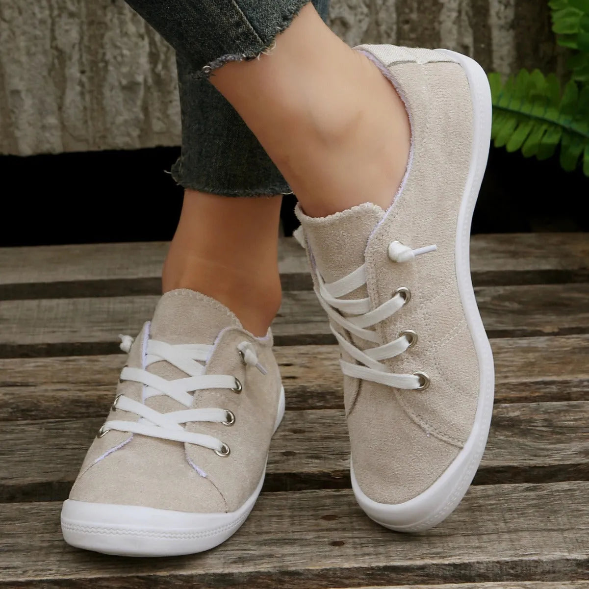 Women's creamy-white casual sneakers with fabric upper and rubber sole, low-top design for versatile wear
