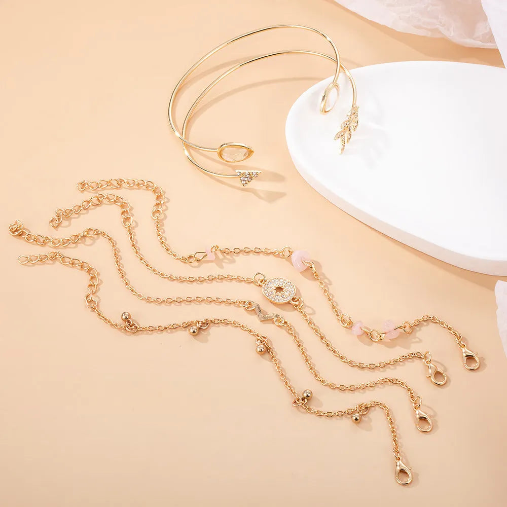 Women's six-piece gold colour zinc alloy bracelet set with arrow and water drop shaped charms