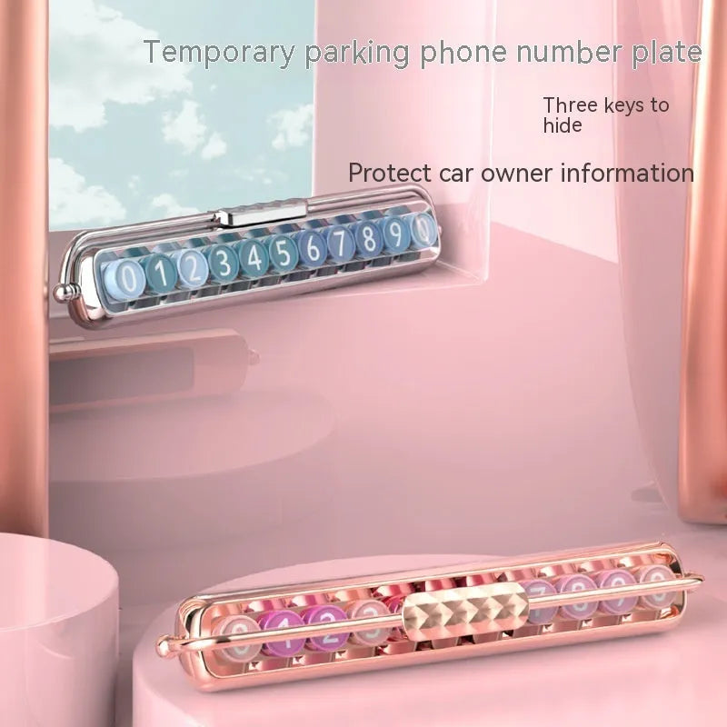 Plastic temporary parking number plate showing coloured number keys on different coloured backgrounds.