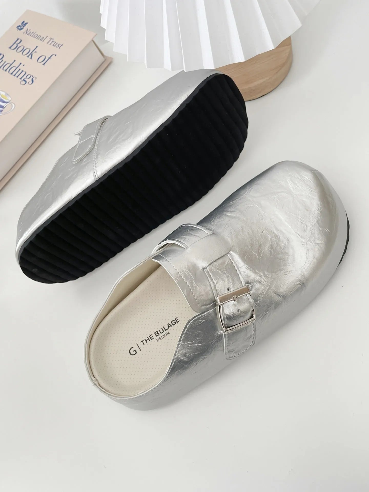 Flat buckle casual sneakers in yellow, creamy-white, silver, and black colours, showing round toe and PU upper.