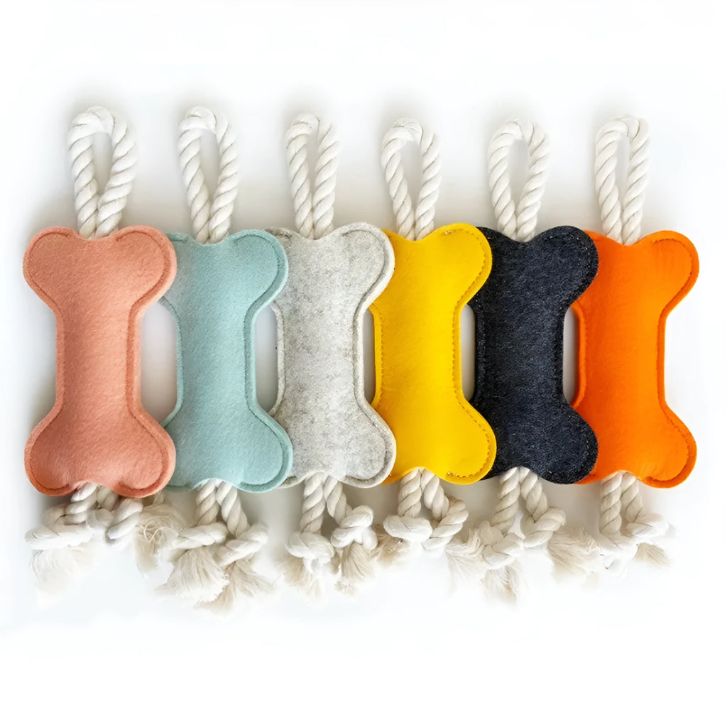 Bone-shaped dog toy with rope knots in felt construction, measuring 16cm by 7cm