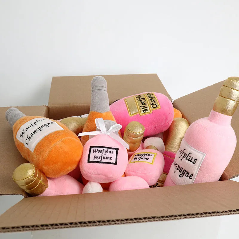 Green plush wine bottle dog toy with squeaker, measuring 20cm in height, on a white background