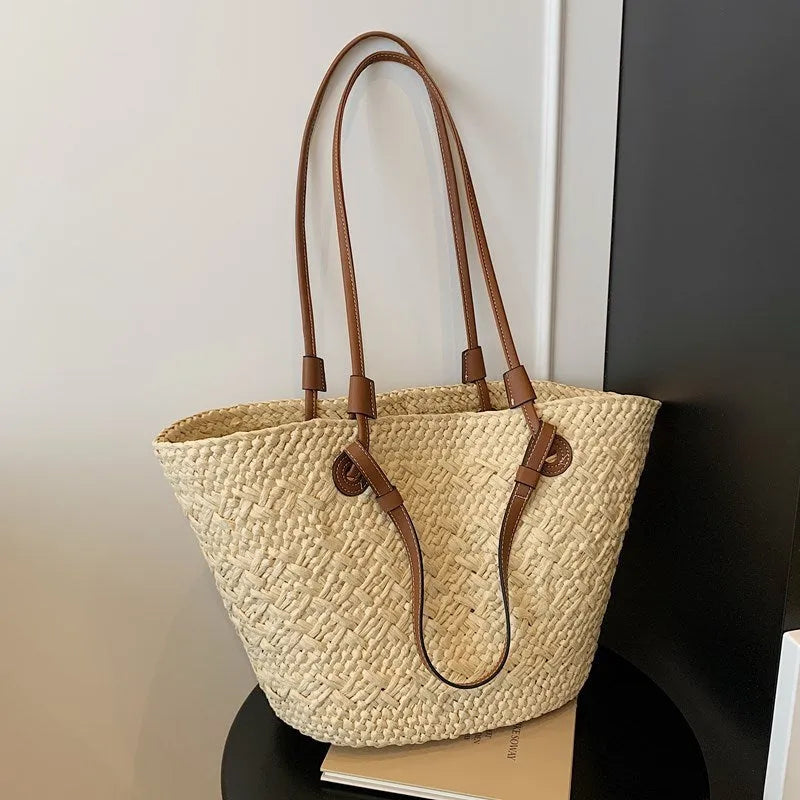 Large woven shoulder hand-carry bag in retro styling with horizontal square shape
