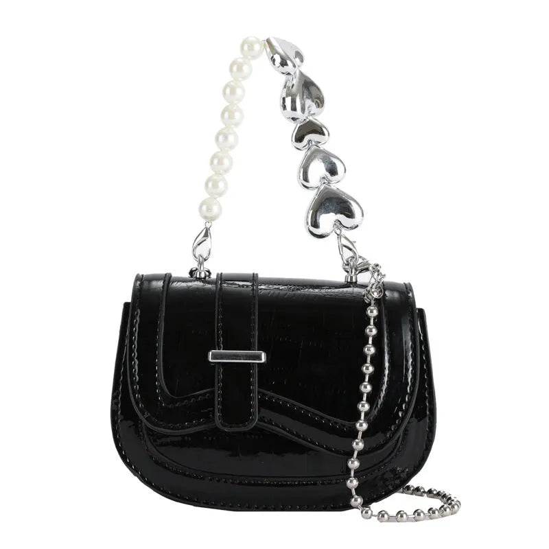 Laser Pearl Tote Saddle Girl Mini crossbody bag in gold colour showing horizontal square design and shoulder strap