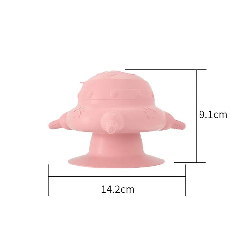 Pink silicone pet milk feeder with pacifier on a flat base, for puppies and kittens.