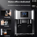 Black desktop ice maker machine with stainless steel interior on a kitchen countertop