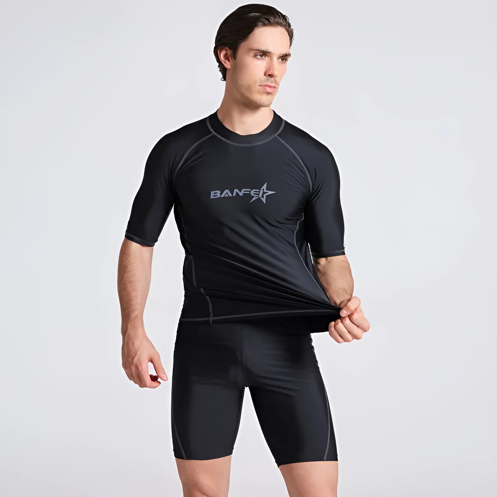 Men's blue quick-dry nylon two-piece swim set with half-sleeve top and swim pants laid flat